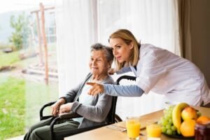 Lady-assisted-by-caregiver